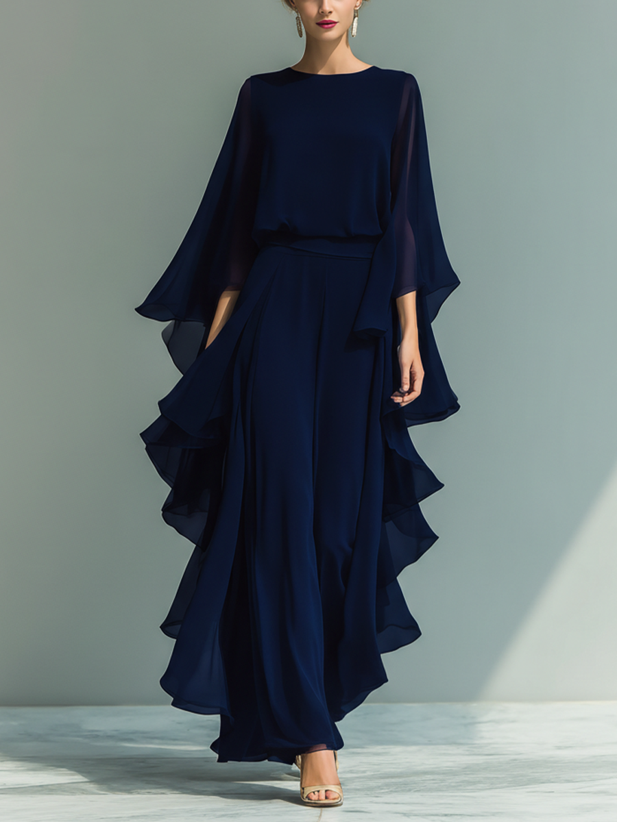 Conjunto de mujer con top de chiffon azul marino de mangas acampanadas y pantalón recto con detalles de volantes