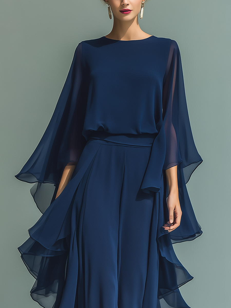 Conjunto de mujer con top de chiffon azul marino de mangas acampanadas y pantalón recto con detalles de volantes