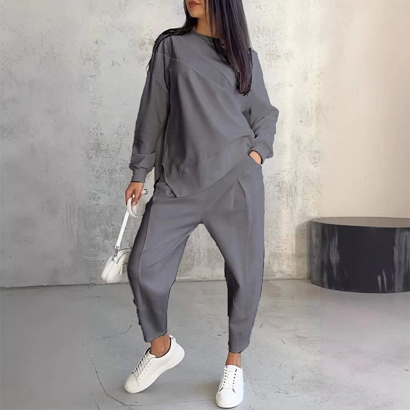 Conjunto de dos piezas para mujer: sudadera de manga larga con bajo asimétrico y pantalón.